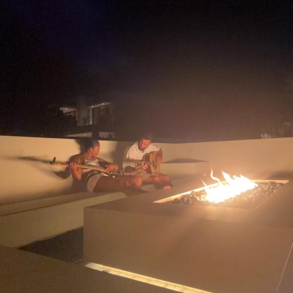 And this move! Curry holds guitar and plays a romantic ensemble with Ayesha by the bonfire and enjoys the world of two